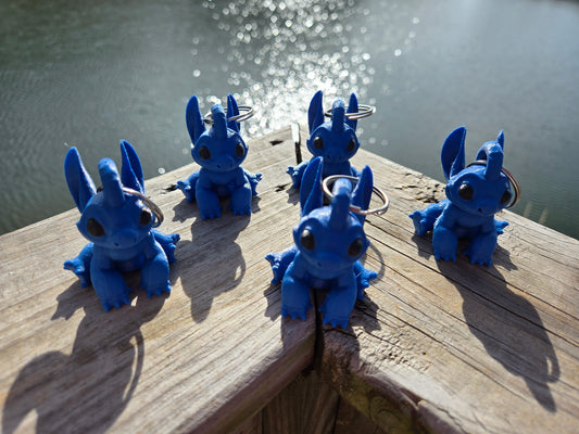 A blue koala like extra terrestrial keychain